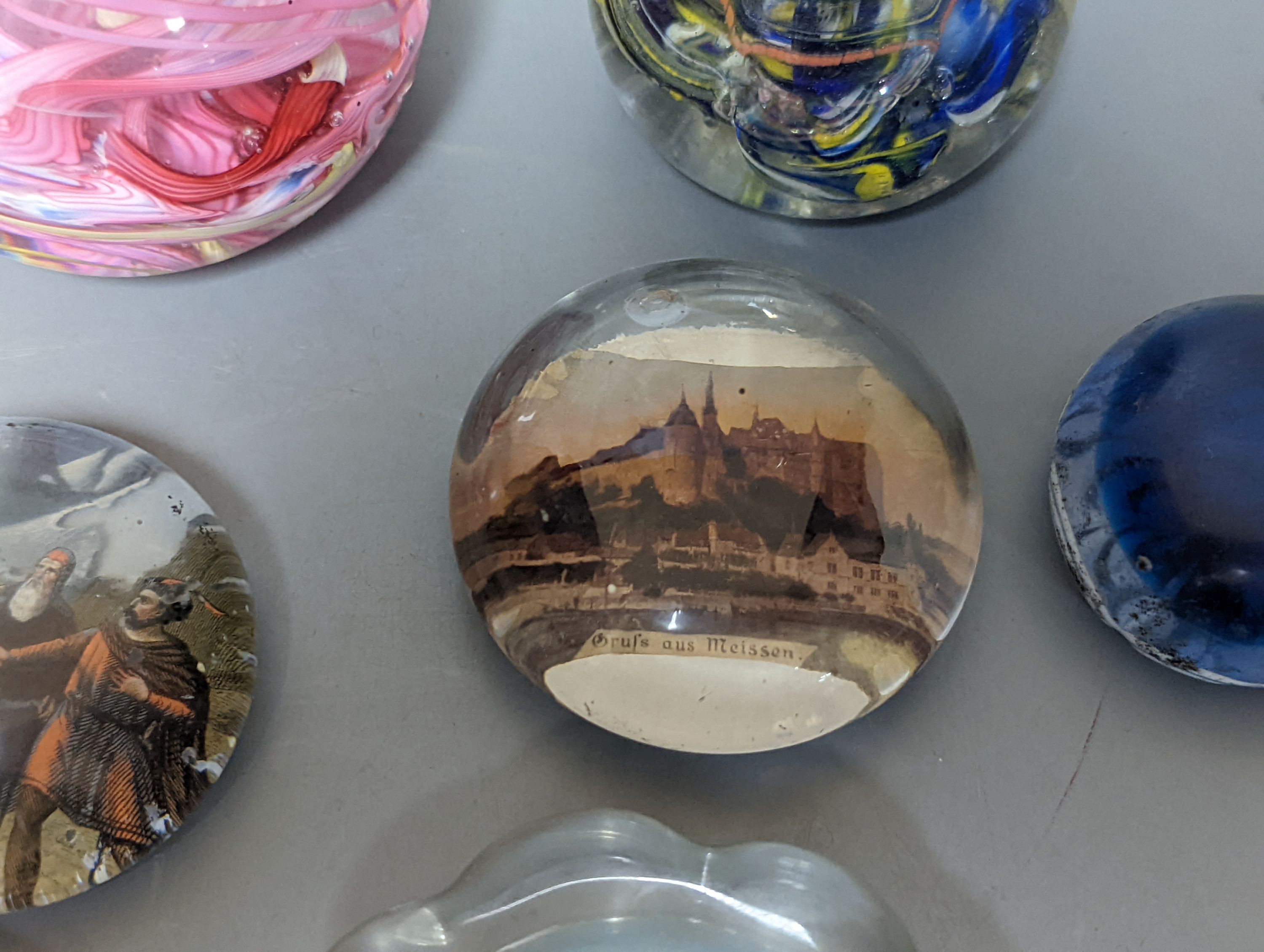 Nine various glass paperweights